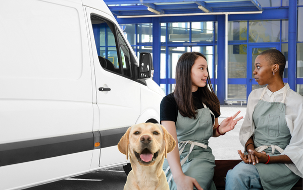 A concerned pet owner talking to a mobile groomer about an injury claim.